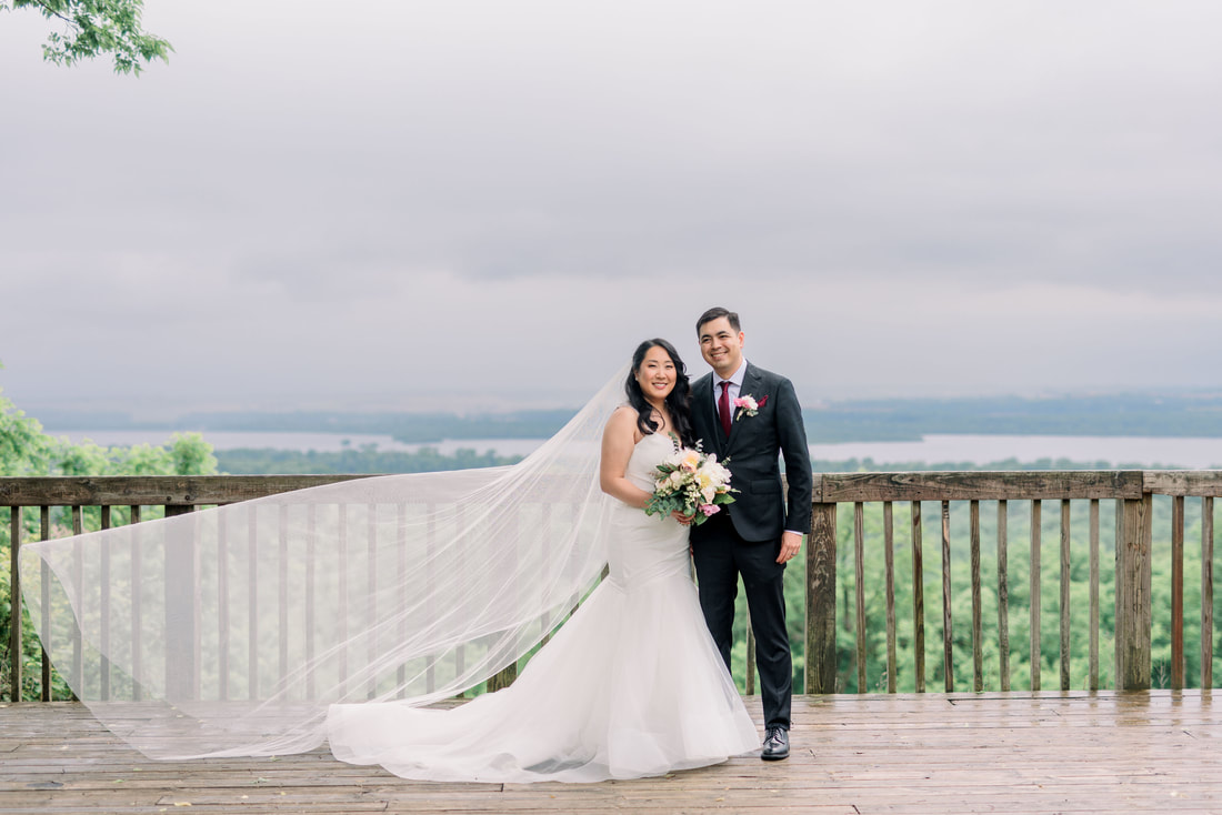 Pere Marquette State Park hilltop overlooking Missouri Rive with bride and groom