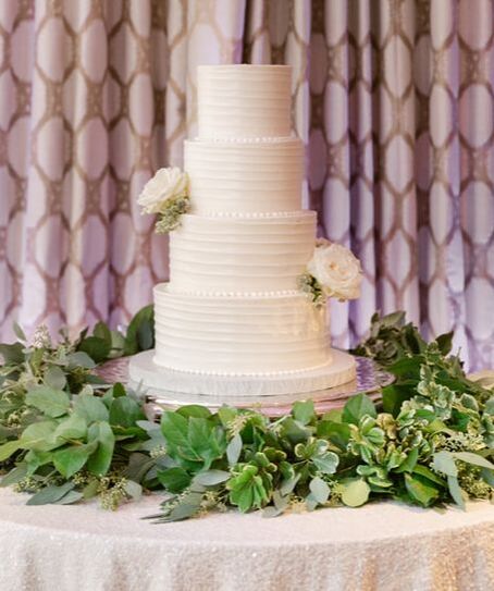 Four tier white wedding cake