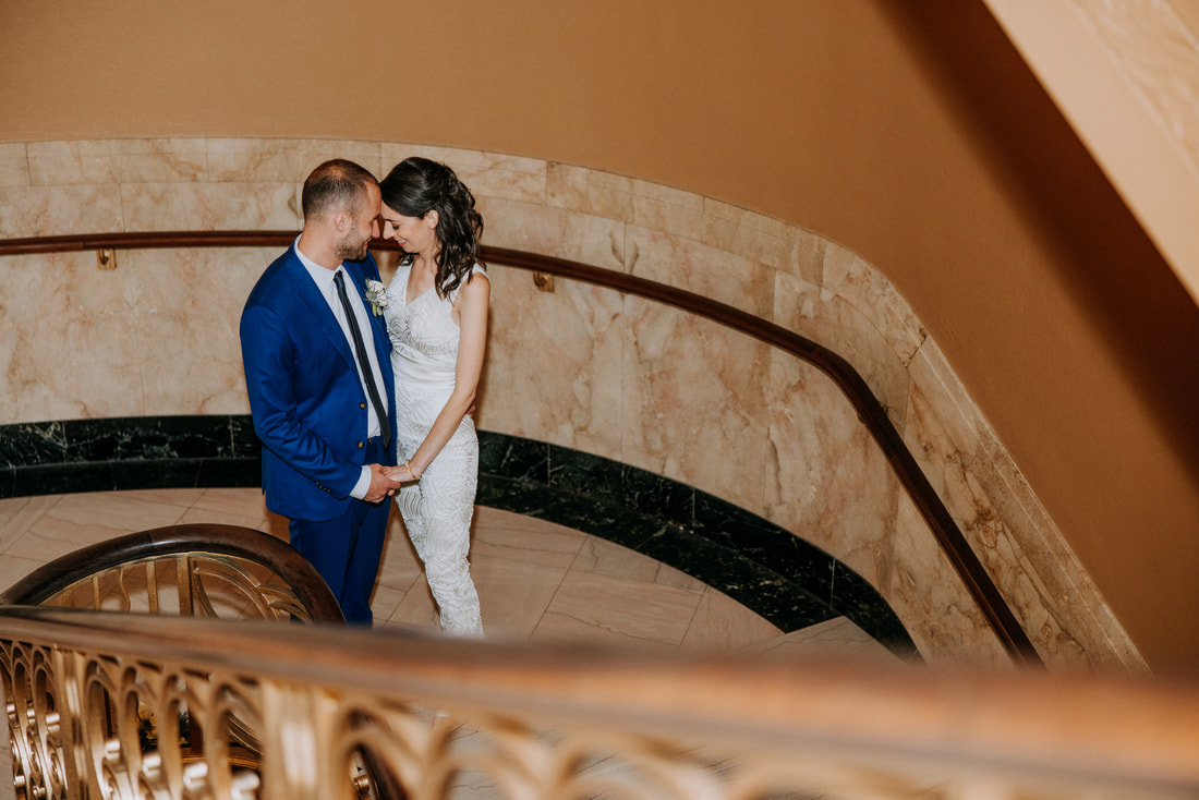 Private bride and groom photo on staircase