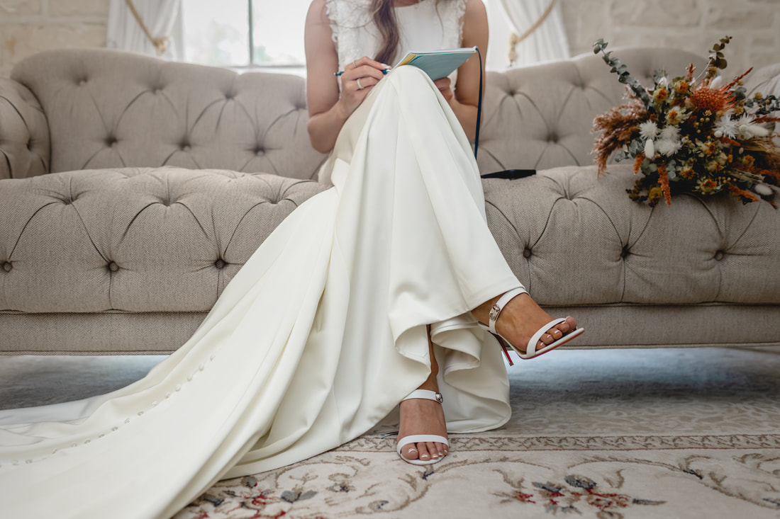 Bride reading private vows from groom