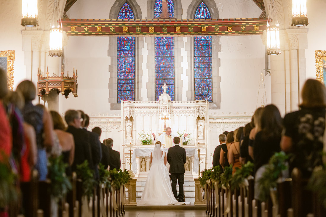Bride and groom at altar at Catholic ceremony